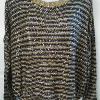 suéter rayas negro y oro